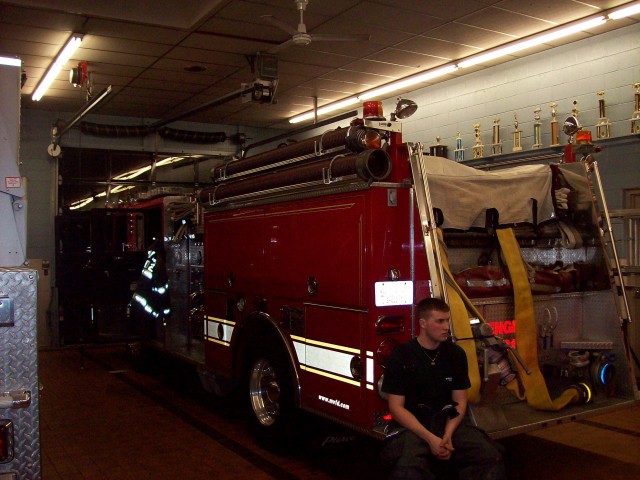 Firefighter Jeremy Hemming sits on Engine 21 at a recent fill in at Hughesville Station 2